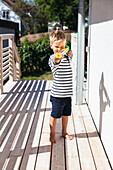 Boy playing with water gun