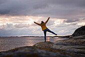 Woman on rocky coast