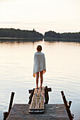 Girl standing on jetty