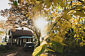 Car in front of wooden house