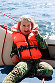 Smiling girl on boat