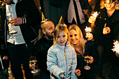 Parents with daughter at party