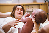 Woman getting newborn baby