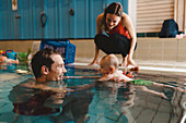 Father with baby in swimming-pool