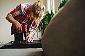 Woman using electric screwdriver