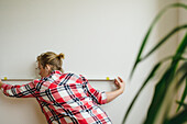 Woman leveling wall