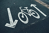 Bicycle road sign painted on street