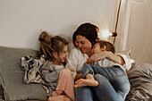 Mother reading to children