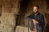 Smiling man in barn