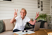 Woman making peace sign