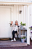 Woman sitting on porch