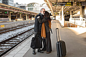 Mature couple on train station platform