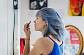 Young woman doing make-up