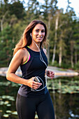 Woman jogging with earphones