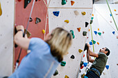 Man on climbing wall