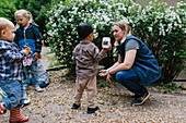 Teacher with children outside