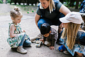 Teacher with children outside