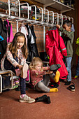 Children getting dressed at school