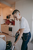 Woman hoovering apartment