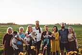 Smiling family looking at camera