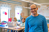 Smiling teacher in classroom