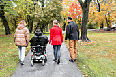 Family walking through park