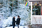 Female couple standing near house