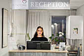 Receptionist looking at camera