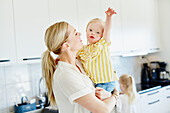 Mother with daughter in kitchen