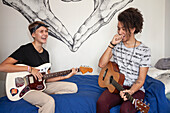 Young people playing guitars