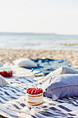 Strawberry cake on beach towels