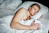 Man sleeping in bed