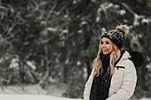 Smiling young woman looking away