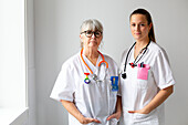 Two female doctors looking at camera