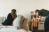 Mother playing with daughter at home