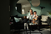 Father with children in living room