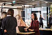 Smiling woman working at reception