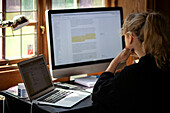 Woman using computer at home