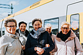 Women on train station platform