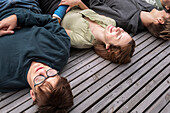 High angle view of teenage friends relaxing