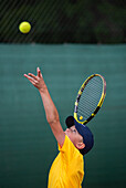 Boy playing tennis