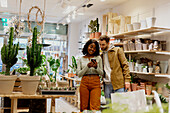 Young couple in flower shop