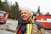 Smiling firefighter looking away