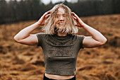 Happy young woman looking at camera