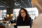 Woman in cafe looking away