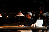 Mature businesswoman in cafe