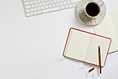 Coffee and notepad on desk