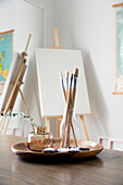 Paint brushes in artist studio