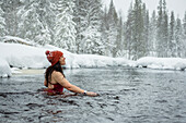Woman in winter river
