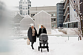 Female couple walking together at winter
